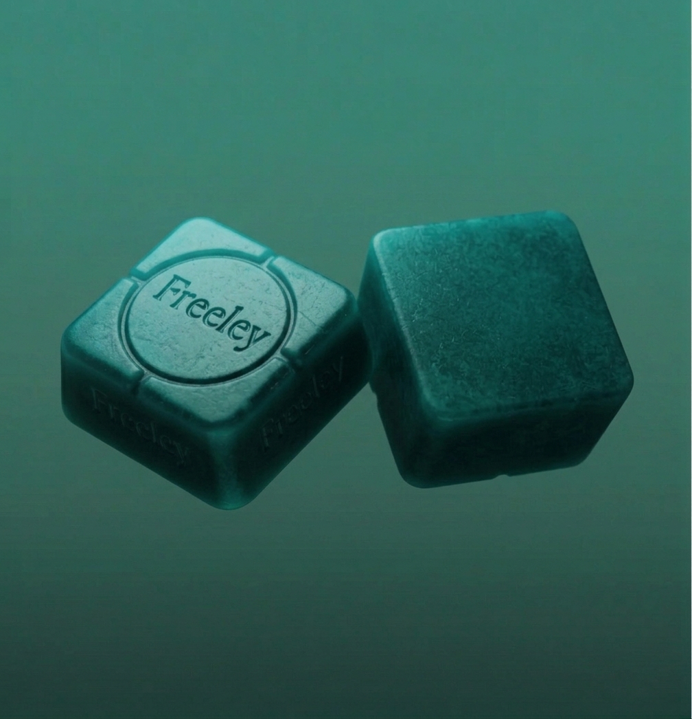 Freeley Vast Troche — close-up of two engraved sublingual tablets